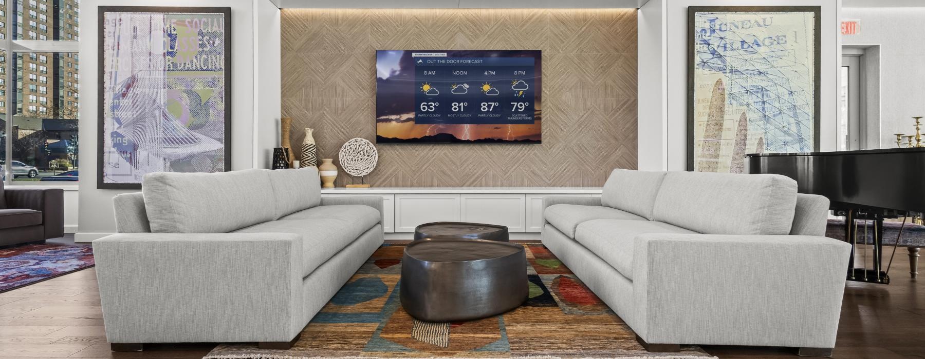 a living room with a large screen